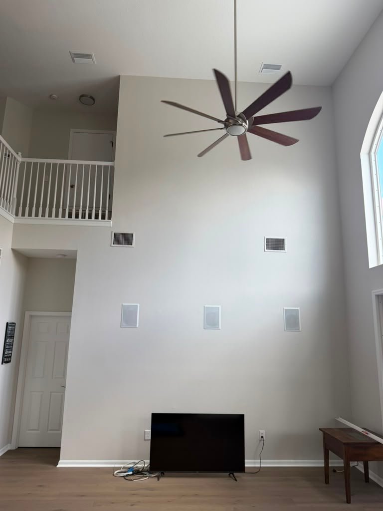 Two-story entertainment wall, before